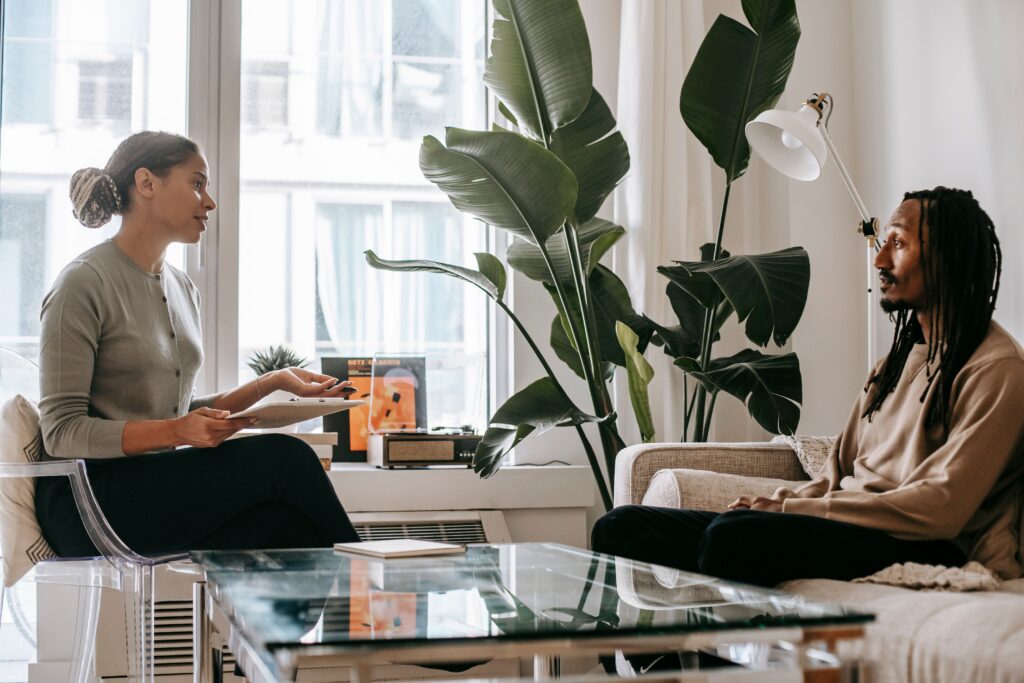 a provider and a patient sit in a relaxing office setting